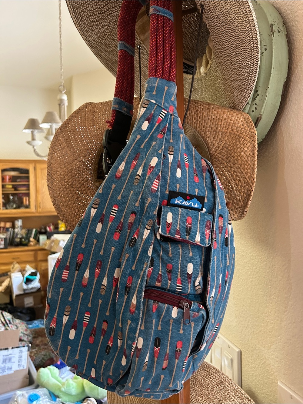 Kavu Teal Paddle-Print Rope Sling Bag with Red Accents